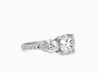 Eternal Brilliance Centre Stone Round Shape With Side Stone Pear Shape Diamond Channel Set Ring