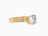 Regal Radiance Round Shape Brilliant Cut Diamond Side Multi Stone Channel Set Solitaire Ring